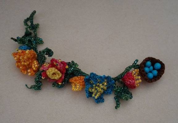 crochet garden flowers bracelet with bird's nest toggle