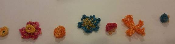 crocheted flowers and buds lsid out in order