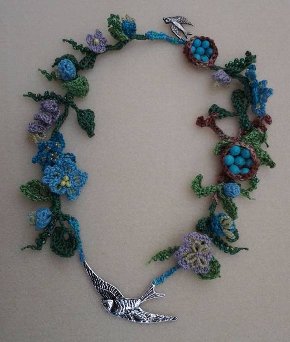 crochet bird necklace with flowers, buds, leaves, tendrils, a branch, 2 bird's nests and 2 silver birds
